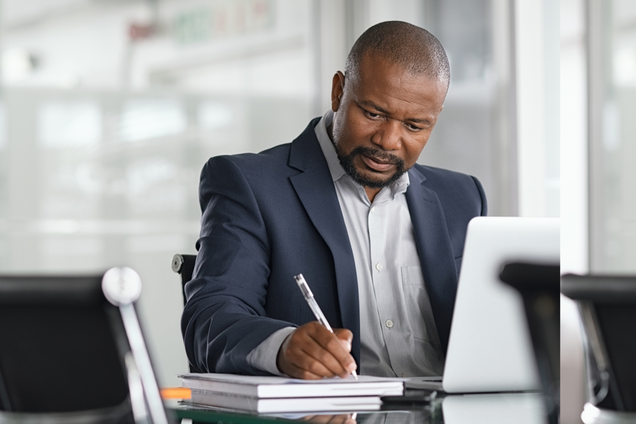 A business owner reviewing his accounts
